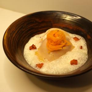 Roast butternut squash Raviolo with a light sherry vinegar cream.