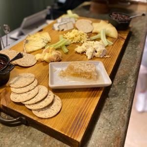 Selection of British Cheeses and crackers with fresh honeycomb in buffet style.