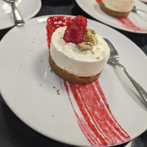 Non-baked rose cheesecake served with raspberry, pistachio and lime.