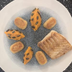 Cornish day boat halibut with crushed pumpkin, hand rolled sage gnocchi, pumpkin seeds and finished table side with a brown butter cream